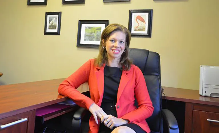 Kelly Thompson, Raleigh family law attorney, seated in her office